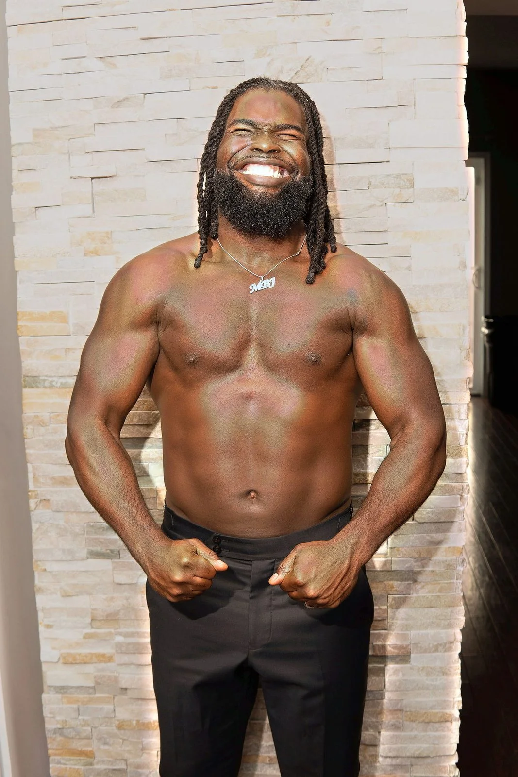 Mario Bonds, founder of Fit Beyond Sight — smiling, showing the physique he built as a visually impaired athlete